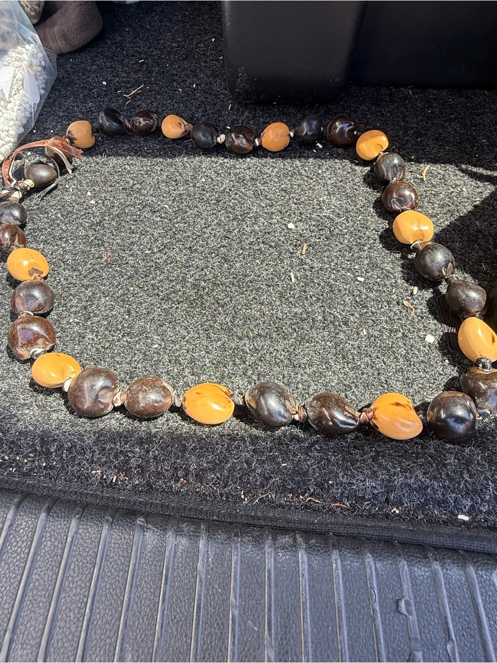 Hawaiian kukui nut lei, combined with other natural seeds. It’s a vintage piece